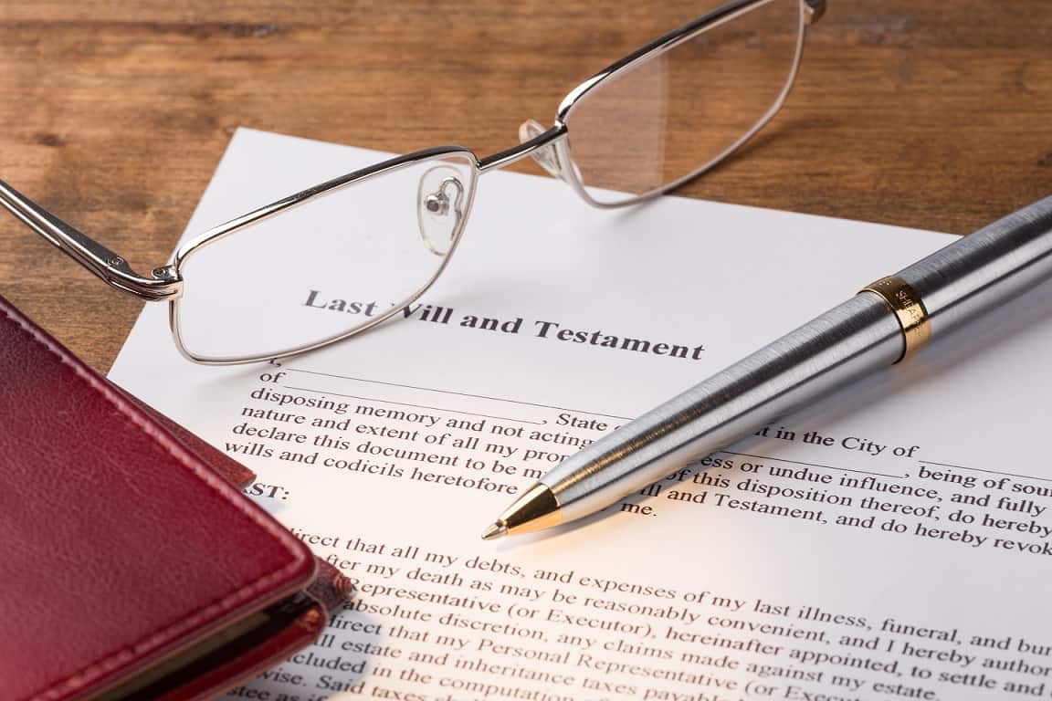 A desk showing a copy of a Will