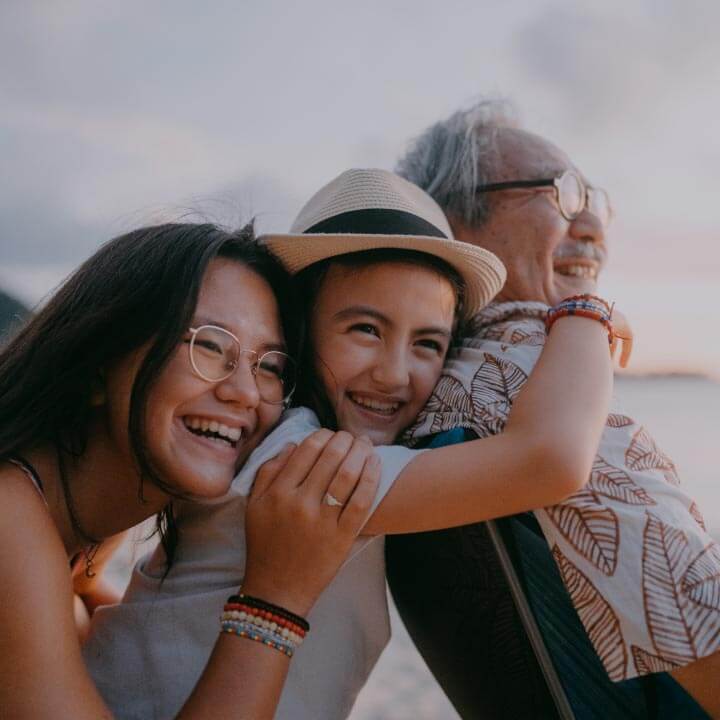 A multi-generational family relax while on holiday.